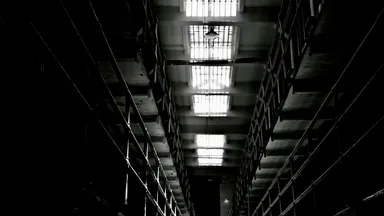 Tiers of empty cells in a disused prison block