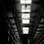 Tiers of empty cells in a disused prison block
