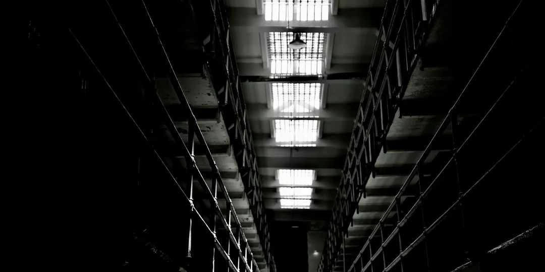 Tiers of empty cells in a disused prison block
