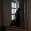 A person seen as a dark reflection in a wall mirror beside a window