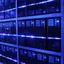 Rows of server racks lit blue inside a data centre