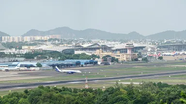 A panoramic view of Chennai International Airport's runway and terminals from St Thomas Mount