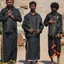 Ayyappa devotees in traditional black pilgrimage attire on the path to Sabarimala