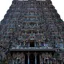 A gopuram at the Meenakshi temple in Madurai, densely covered with painted sculpted figures
