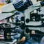 A row of microscopes on a laboratory bench