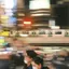 A crowded railway platform in motion blur as a train passes