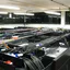 Rows of computer equipment and dense cabling in a server room