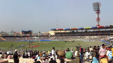 A packed cricket stadium crowd at Eden Gardens, Kolkata